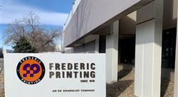 Frederic Printing Company sign and building outdoor against blue sky